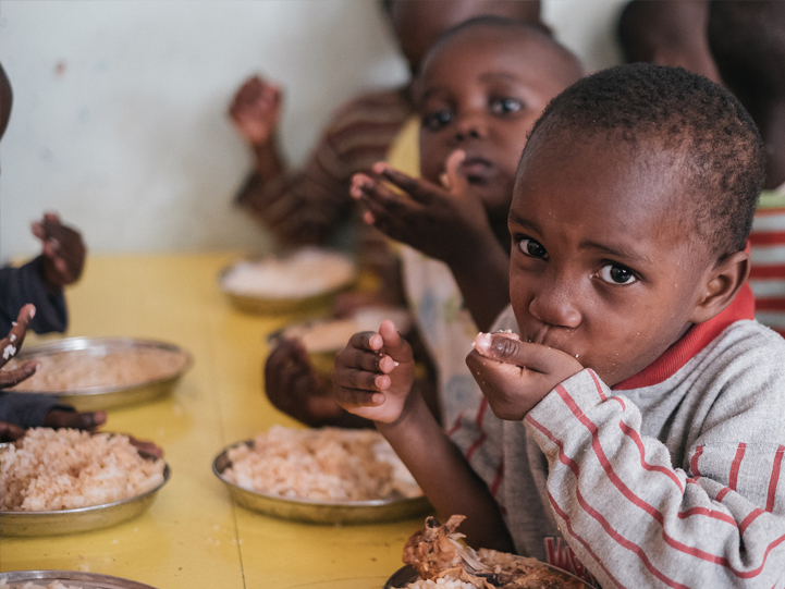 Children being fed at a Parish Homecare Facility